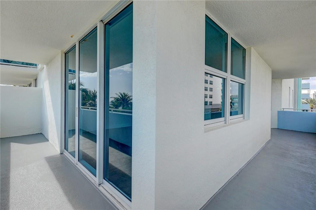 9201 Collins Avenue, Unit 326 Surfside, FL 33154 - Photo 30 of 41 wooden floor and window in a room