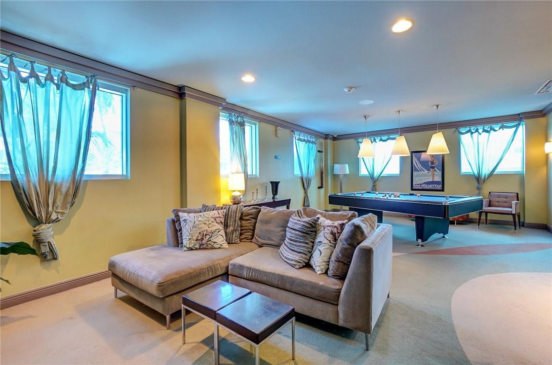 9201 Collins Avenue, Unit 326 Surfside, FL 33154 - Photo 32 of 41 a living room with furniture and a large window