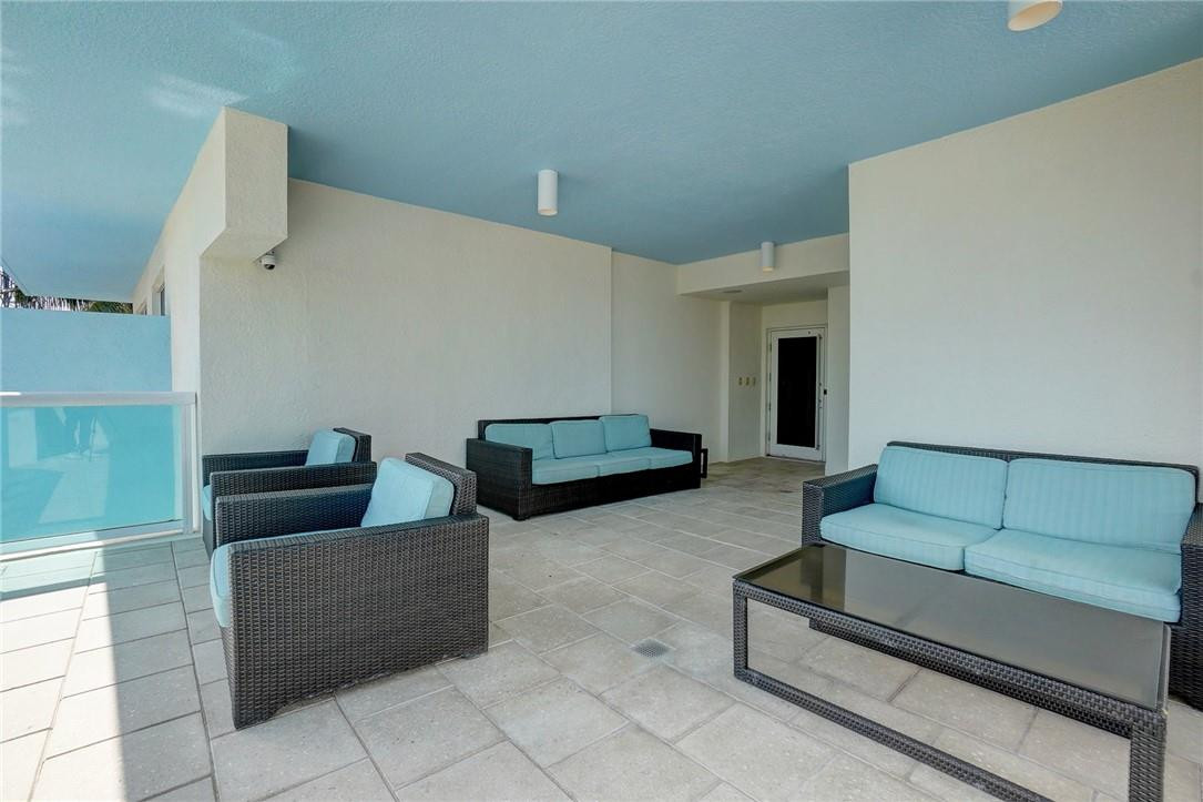 9201 Collins Avenue, Unit 326 Surfside, FL 33154 - Photo 36 of 41 a living room with furniture and a couch