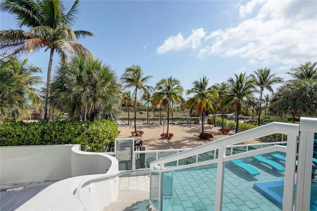 9201 Collins Avenue, Unit 326 Surfside, FL 33154 - Photo 37 of 41 a view of a swimming pool with a patio