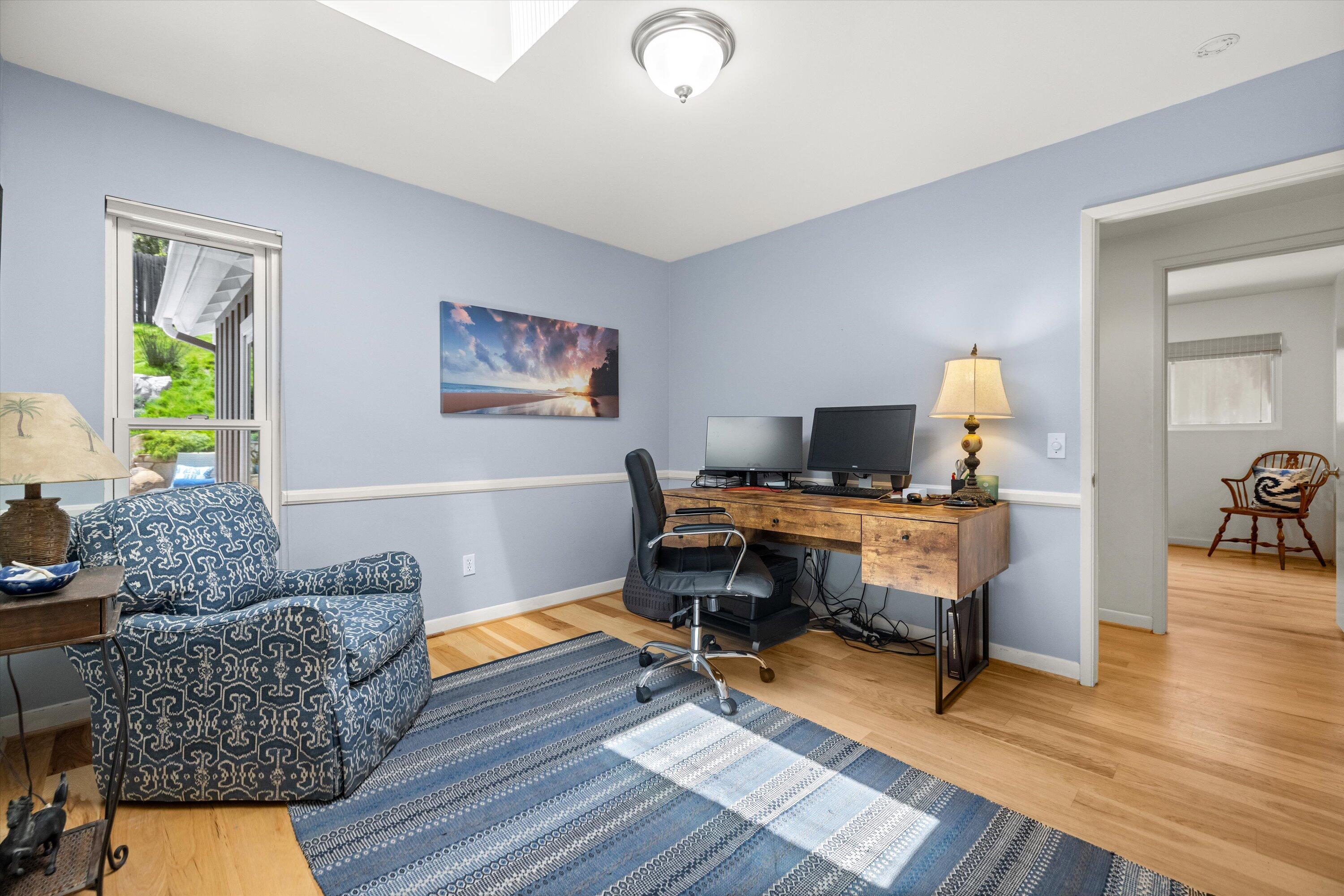 927 Randolph Road Santa Barbara, CA 93111 - Photo 16 of 25 a workspace with furniture and wooden floor