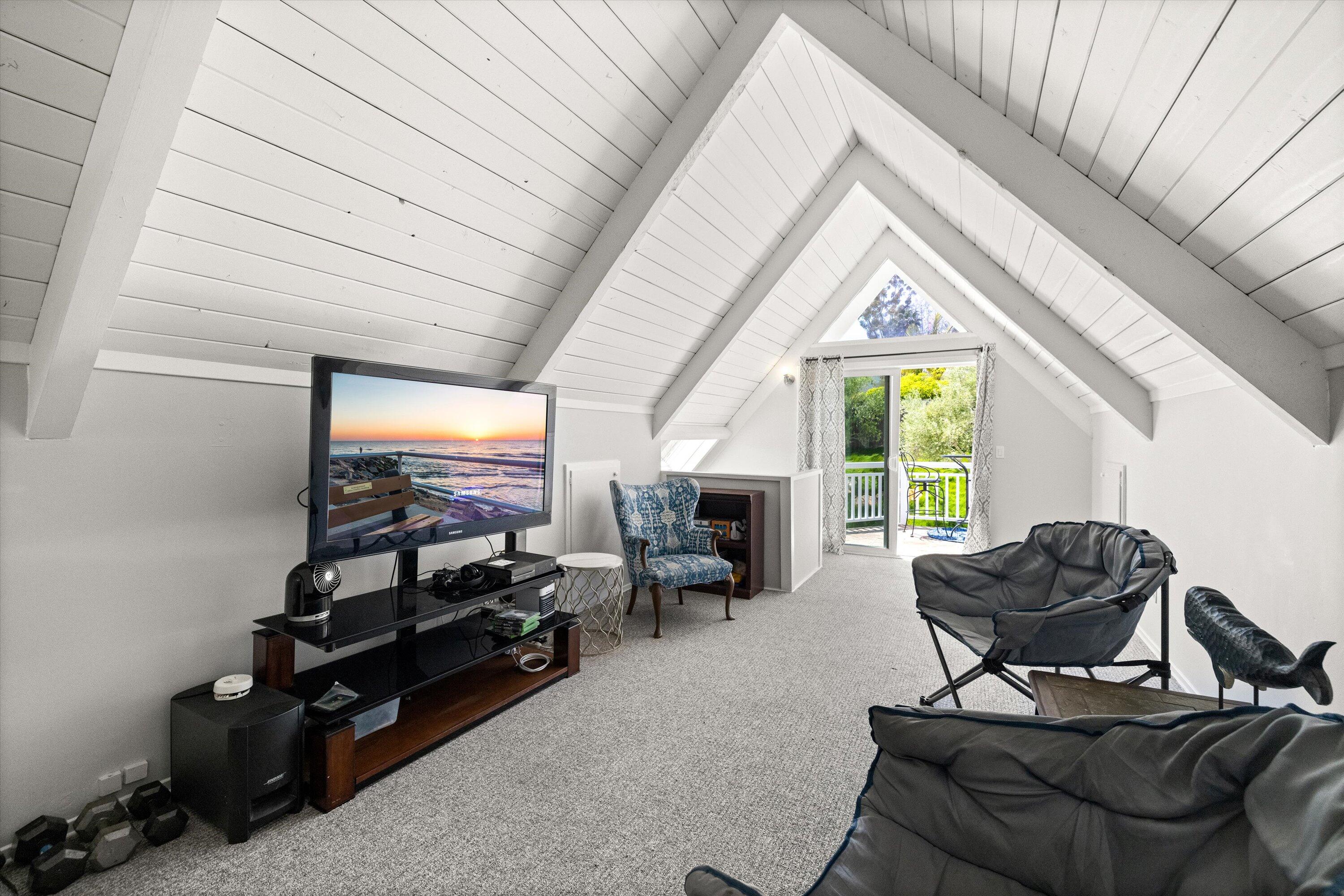 927 Randolph Road Santa Barbara, CA 93111 - Photo 17 of 25 a living room with furniture and a flat screen tv