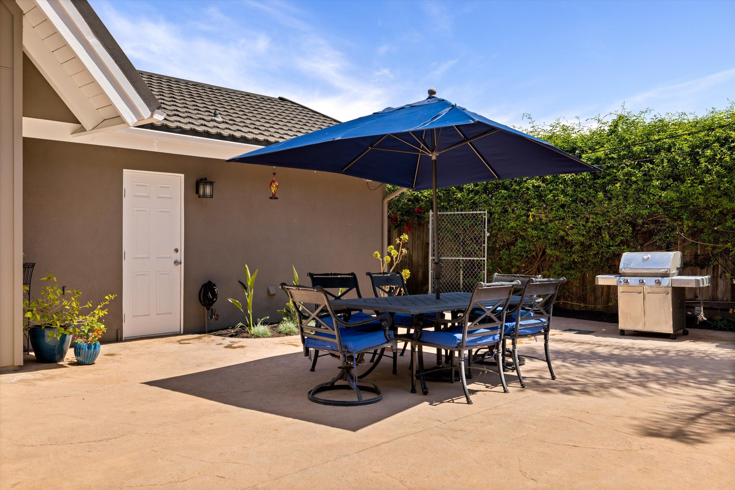 927 Randolph Road Santa Barbara, CA 93111 - Photo 23 of 25 a patio with a table and chairs under an umbrella