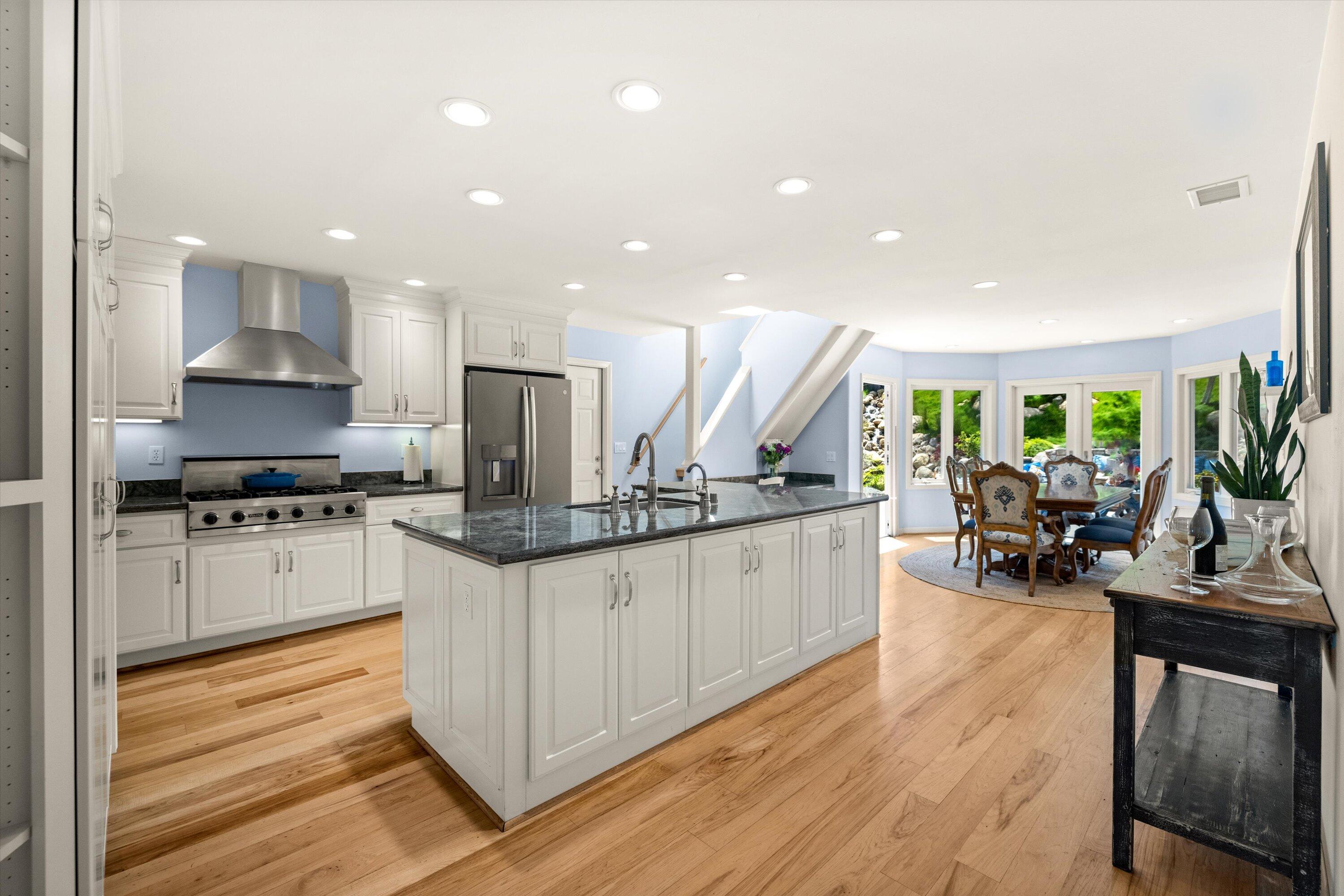 927 Randolph Road Santa Barbara, CA 93111 - Photo 5 of 25 a kitchen with stainless steel appliances kitchen island granite countertop a sink a stove and cabinets