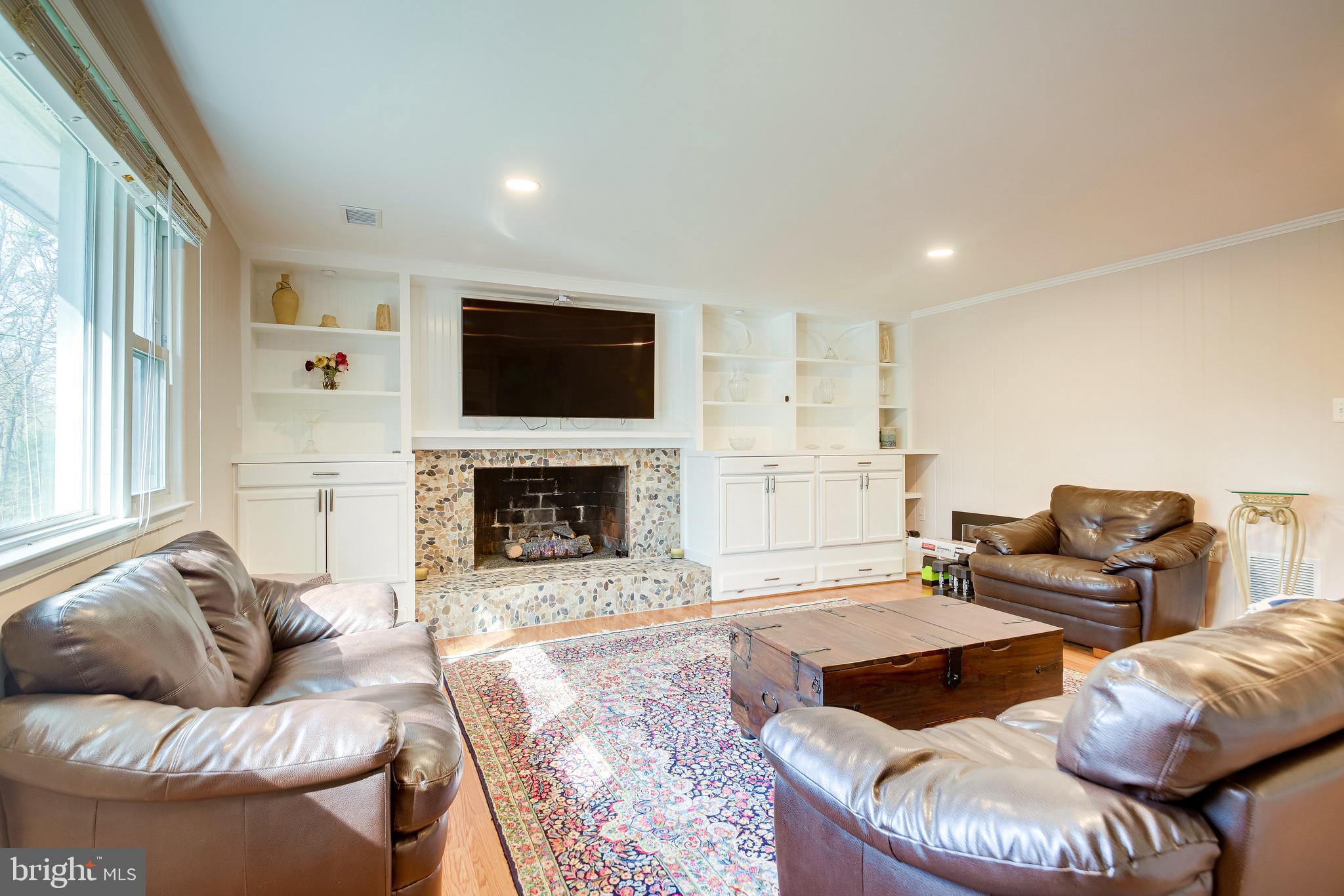 11019 Ring Road Reston, VA 20190 - Photo 18 of 62 Lower Level Rec Room w/ gas fireplace & built-in's