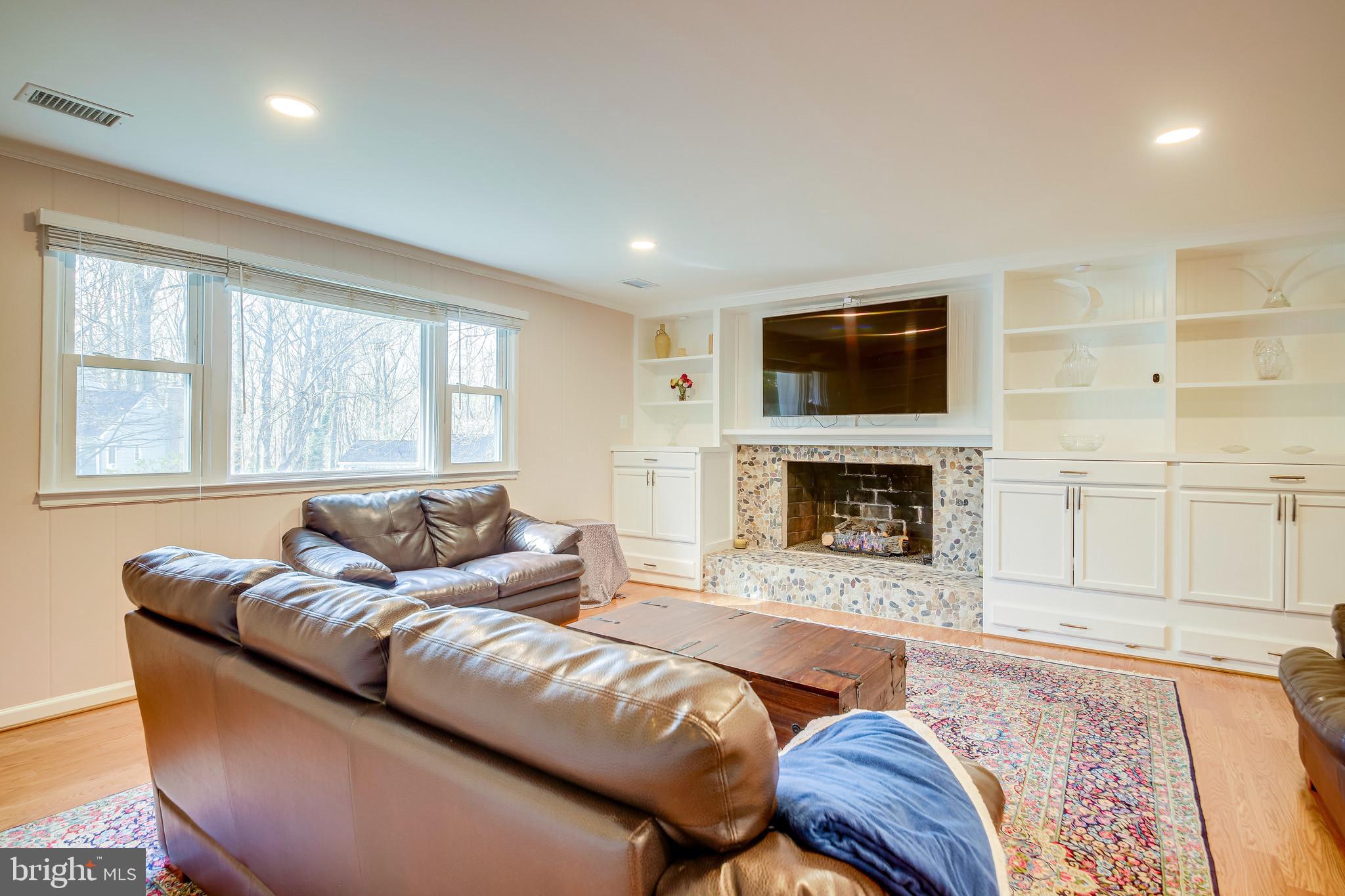 11019 Ring Road Reston, VA 20190 - Photo 19 of 62 Lower Level Rec Room w/ gas fireplace & built-in's