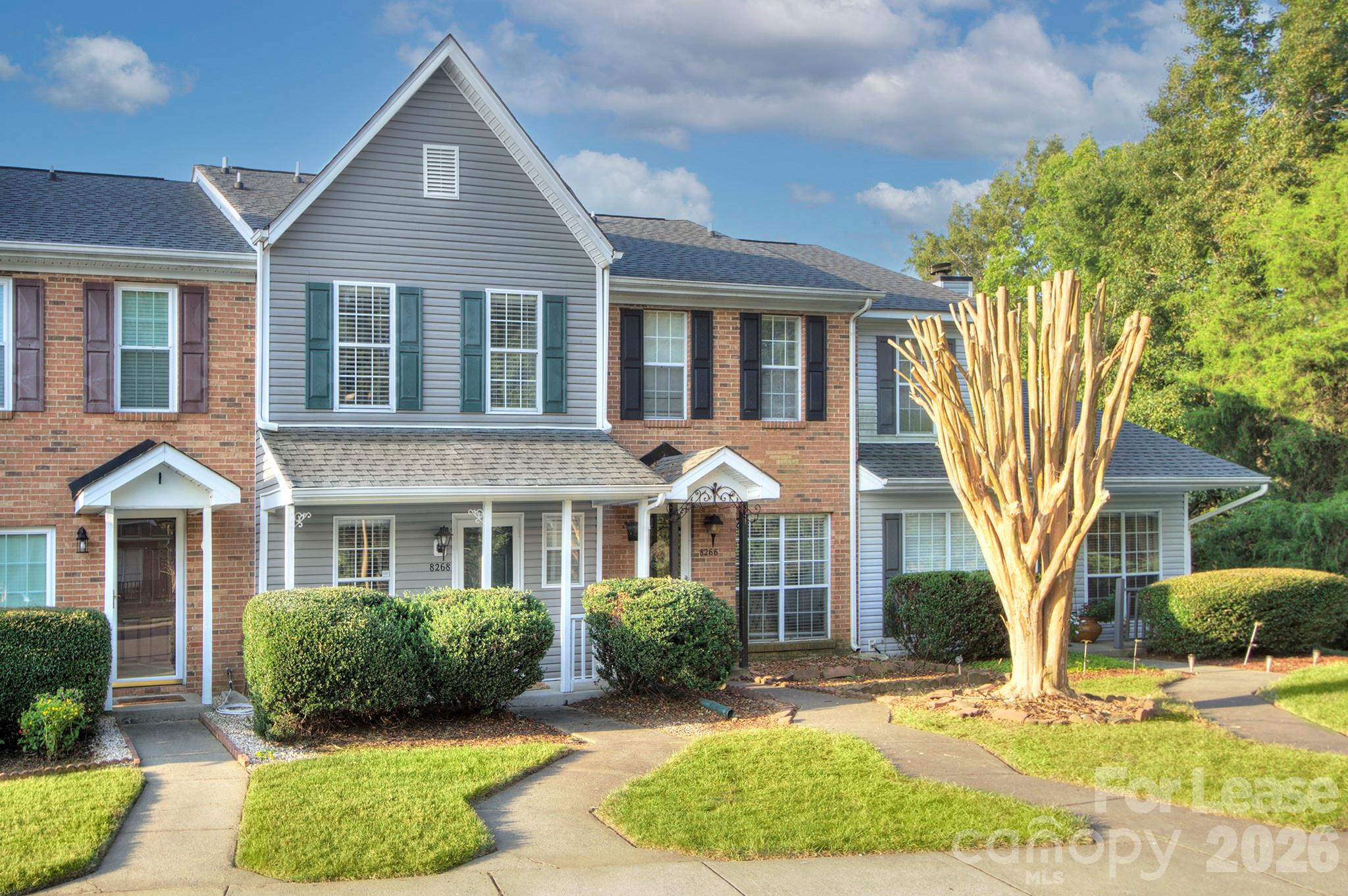 8268 Golf Ridge Drive Charlotte, NC 28277 - Photo 3 of 24 a front view of a house with a yard