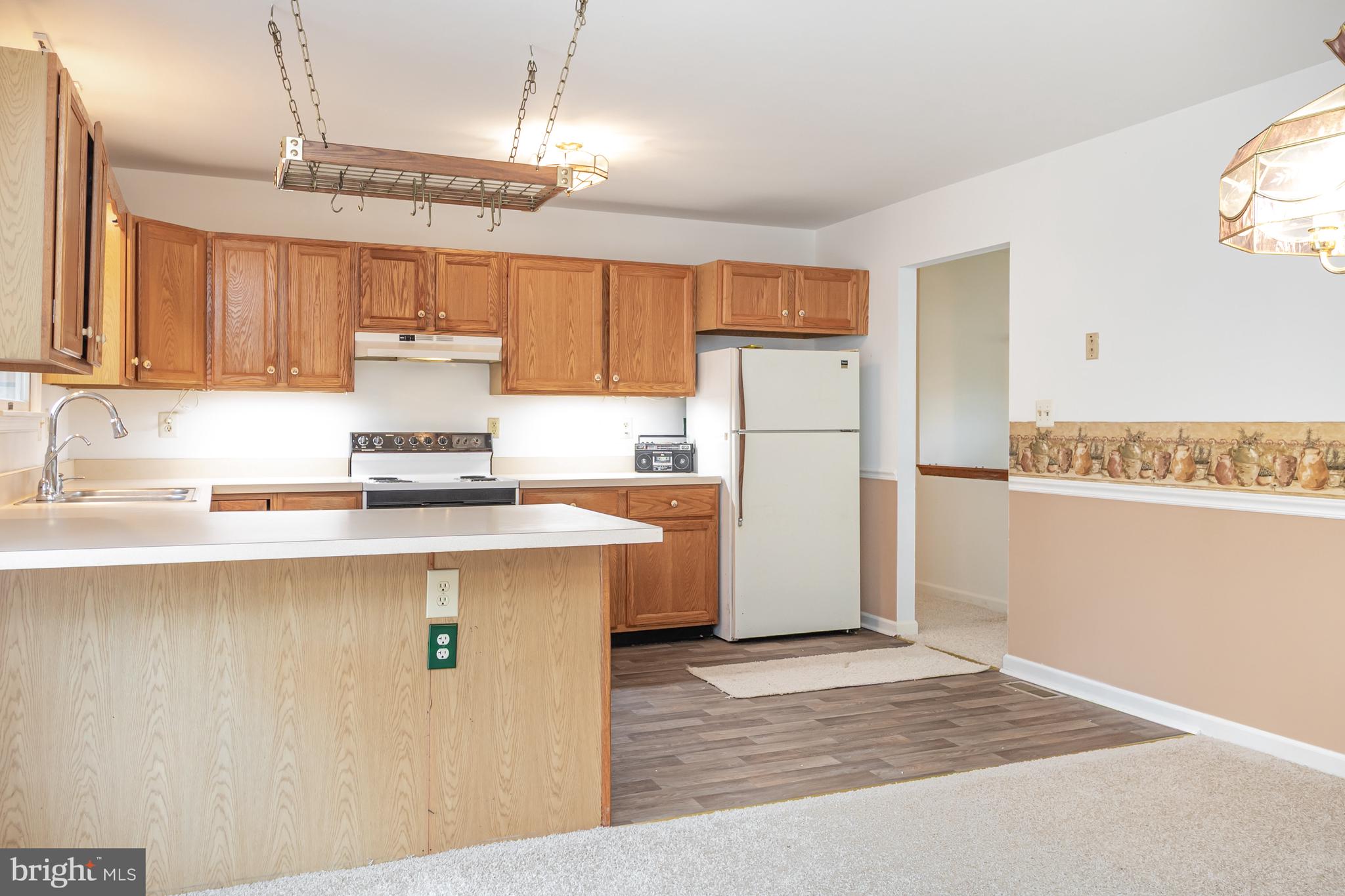 21 Country Lane Colora, MD 21917 - Photo 13 of 68 a kitchen with a refrigerator a stove a sink and cabinets