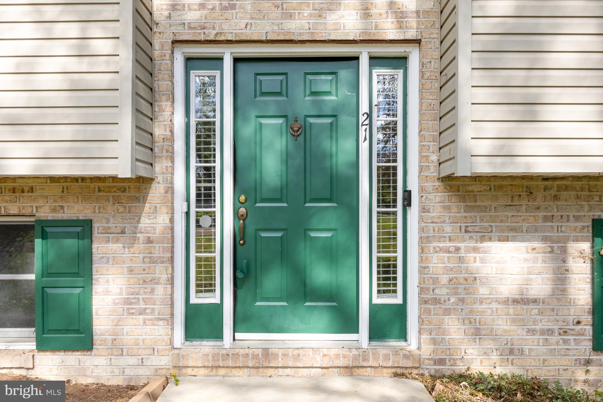21 Country Lane Colora, MD 21917 - Photo 3 of 68 a view of a brick house with a green door