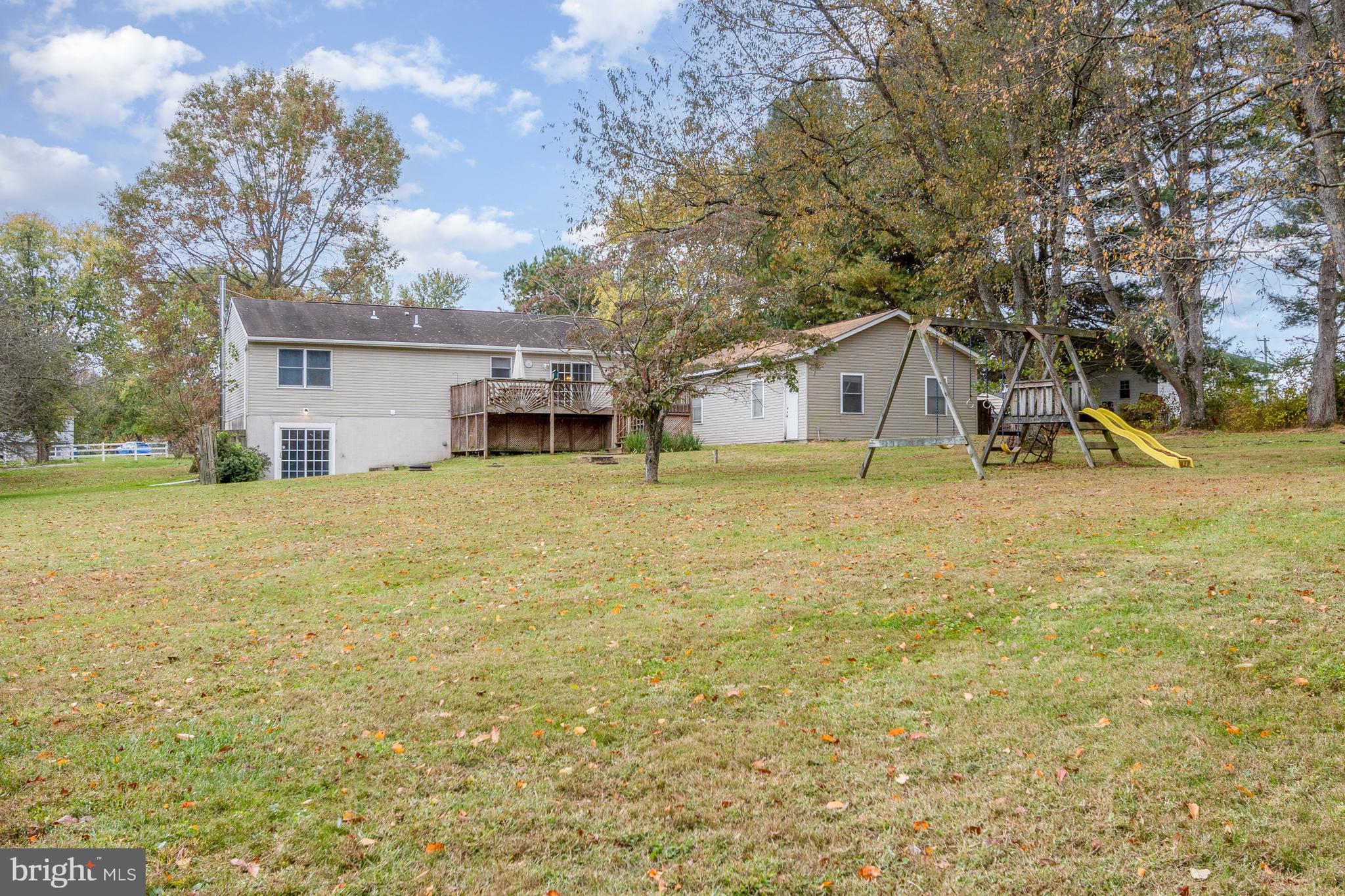 21 Country Lane Colora, MD 21917 - Photo 45 of 68 a view of a house with a yard and sitting area