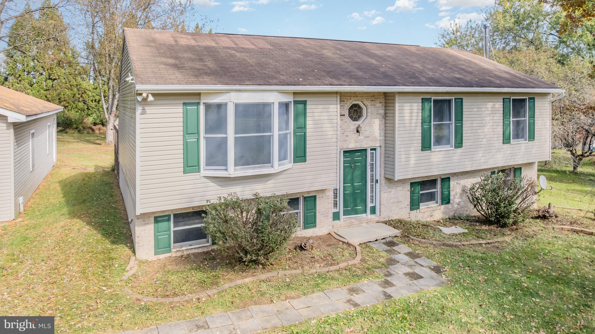 21 Country Lane Colora, MD 21917 - Photo 5 of 68 a front view of a house with a yard