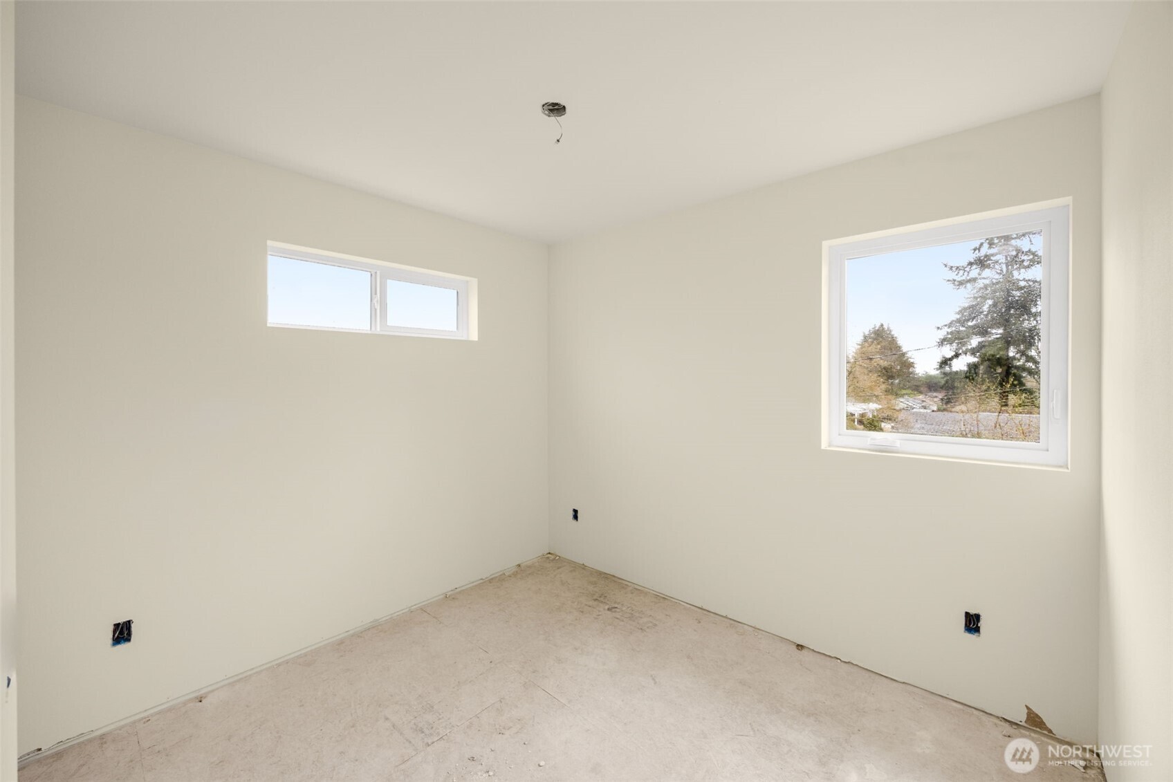 8109 34th Avenue Southwest, Unit B Seattle, WA 98126 - Photo 17 of 25 an empty room with a window