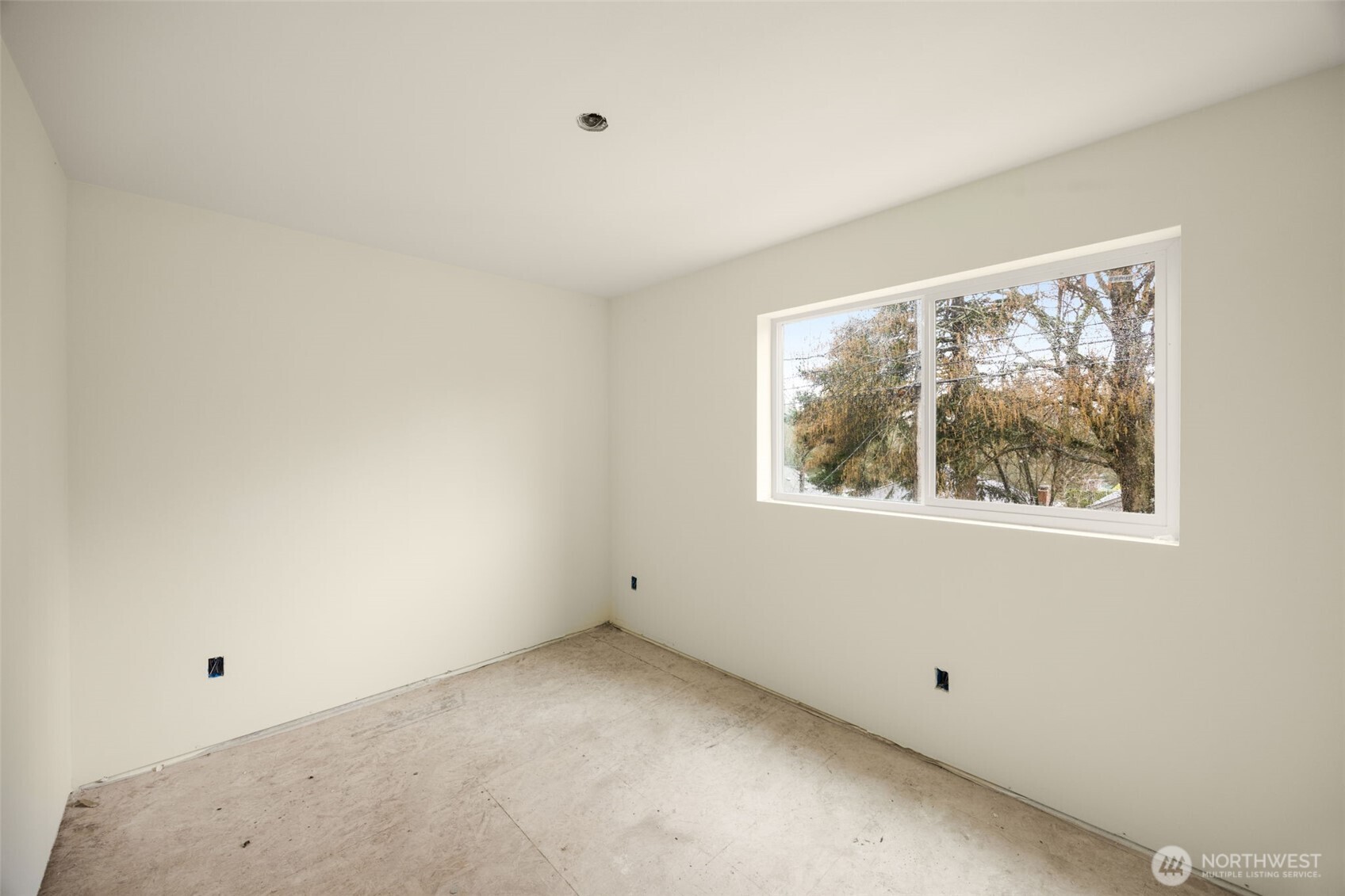 8109 34th Avenue Southwest, Unit B Seattle, WA 98126 - Photo 19 of 25 an empty room with a window