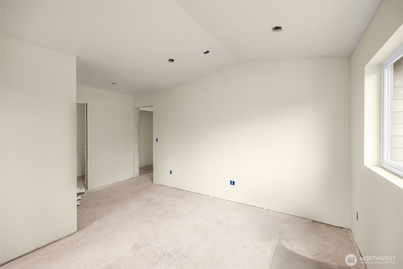 8109 34th Avenue Southwest, Unit B Seattle, WA 98126 - Photo 9 of 25 an empty room with windows