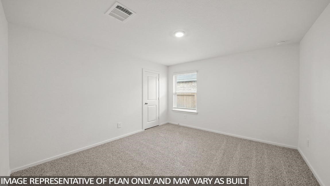 16780 Country Roots Avenue Conroe, TX 77302 - Photo 11 of 25 a view of an empty room with a window