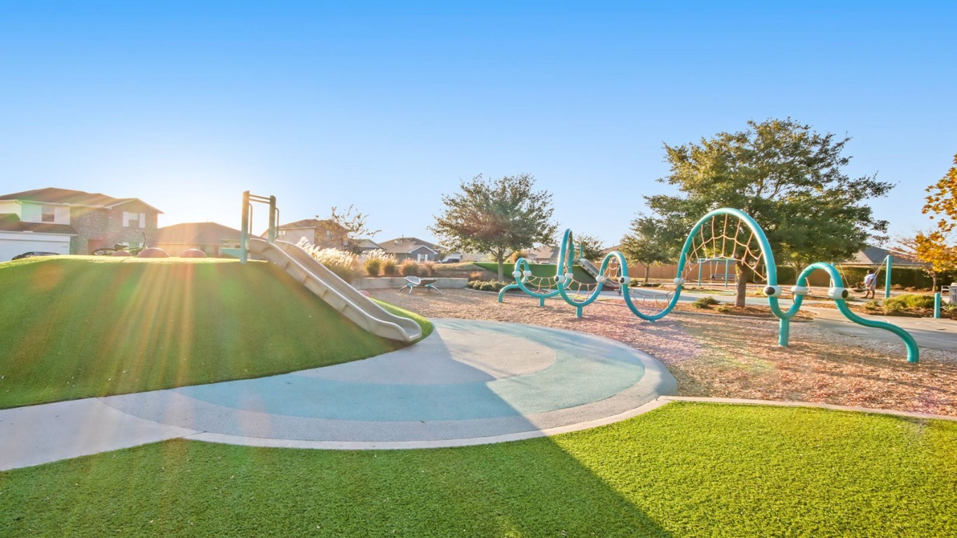 16780 Country Roots Avenue Conroe, TX 77302 - Photo 19 of 25 a view of a swimming pool with a yard