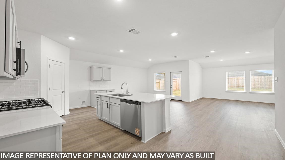 16780 Country Roots Avenue Conroe, TX 77302 - Photo 3 of 25 a view of kitchen with sink wooden floor and windows