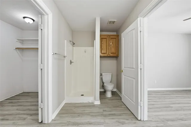 a view of a bathroom with a toilet sink and a shower