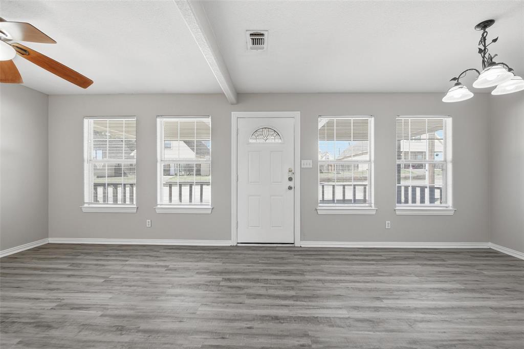 213 Private Road 4573, Unit 228 Boyd, TX 76023 - Photo 20 of 23 a view of an empty room with wooden floor and a window