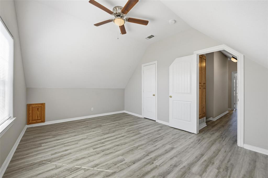 213 Private Road 4573, Unit 228 Boyd, TX 76023 - Photo 6 of 23 an empty room with wooden floor closet and windows