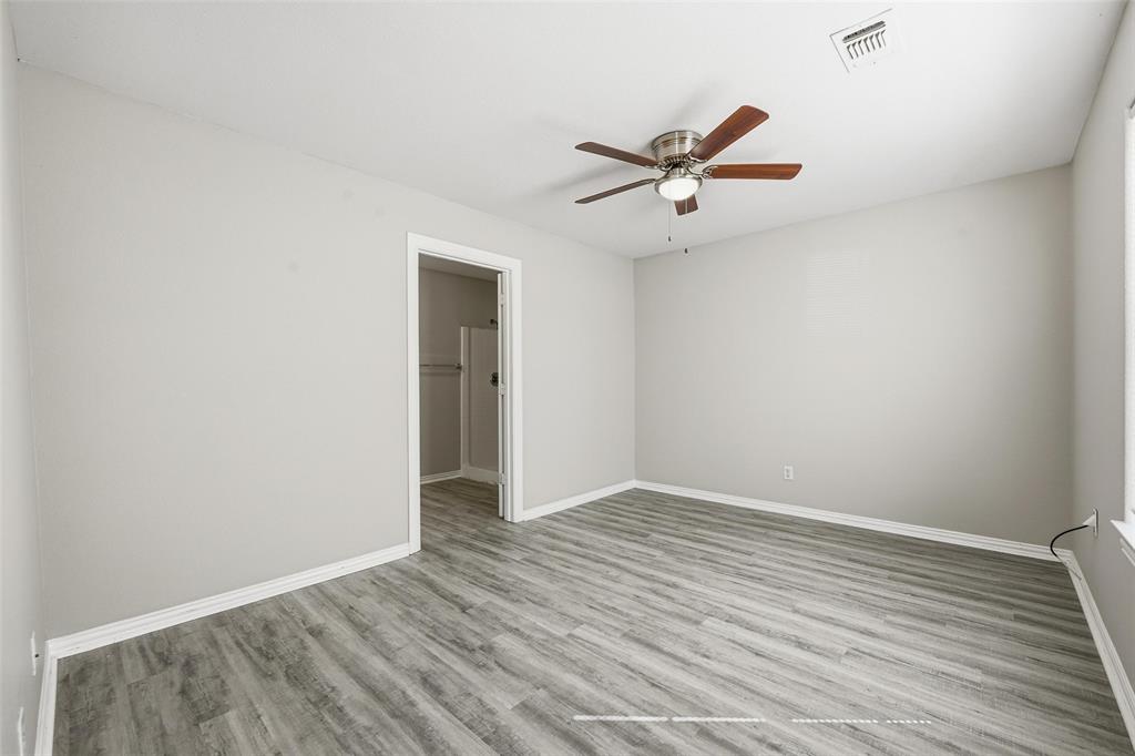 213 Private Road 4573, Unit 228 Boyd, TX 76023 - Photo 9 of 23 a view of an empty room with wooden floor