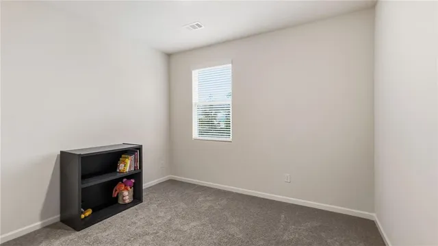 a room with furniture and a window