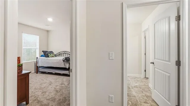 a bedroom with a bed and a couch