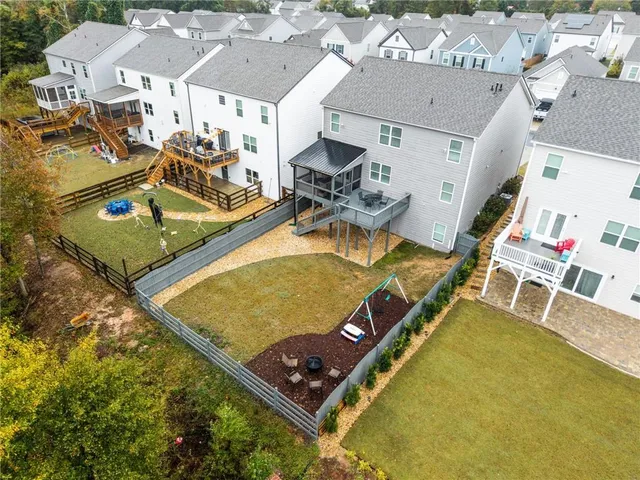 an aerial view of a house with swimming pool