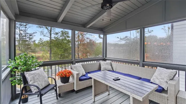 a living room with furniture and a window