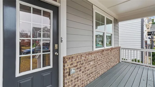 a view of porch with wooden floor