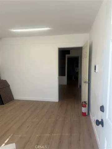 an empty room with wooden floor