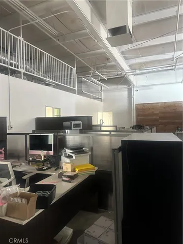 a view of parking garage with lots of car parked