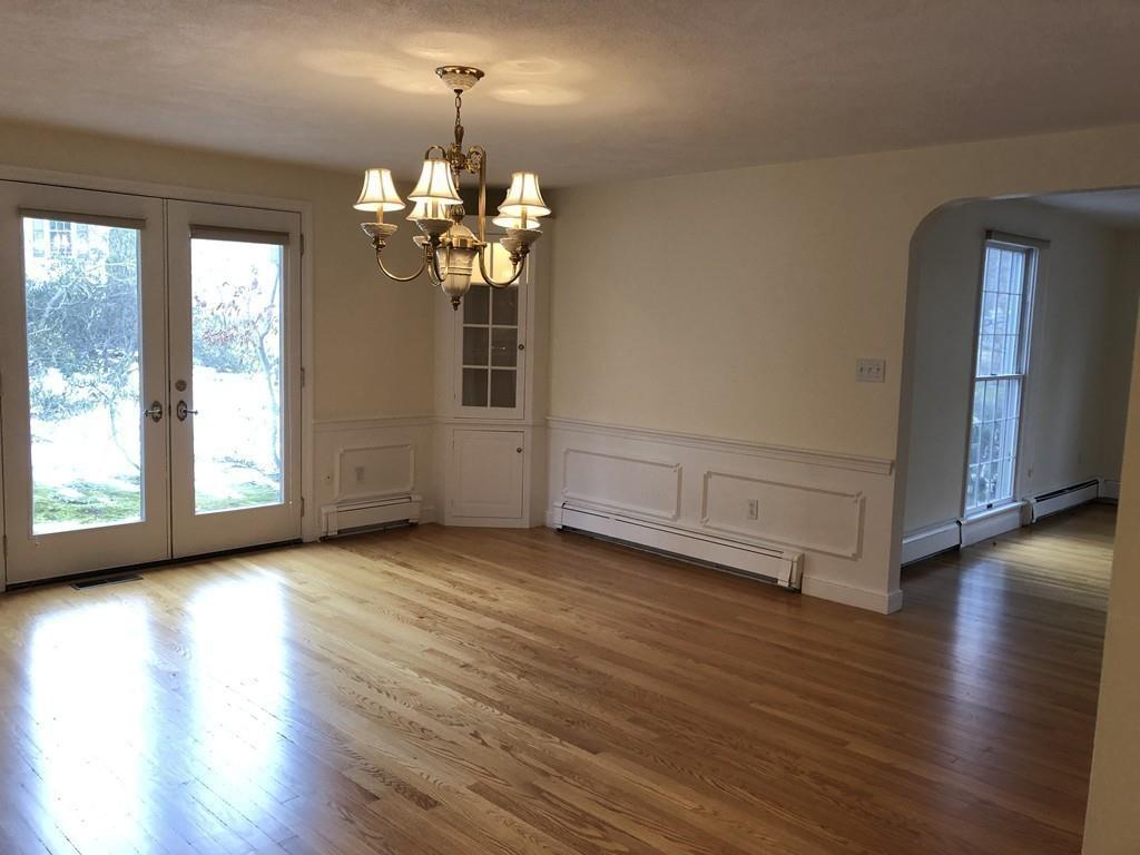 75 Old Farm Road Wellesley, MA 02481 - Photo 16 of 28 a view of a livingroom with a fireplace wooden floor and a window