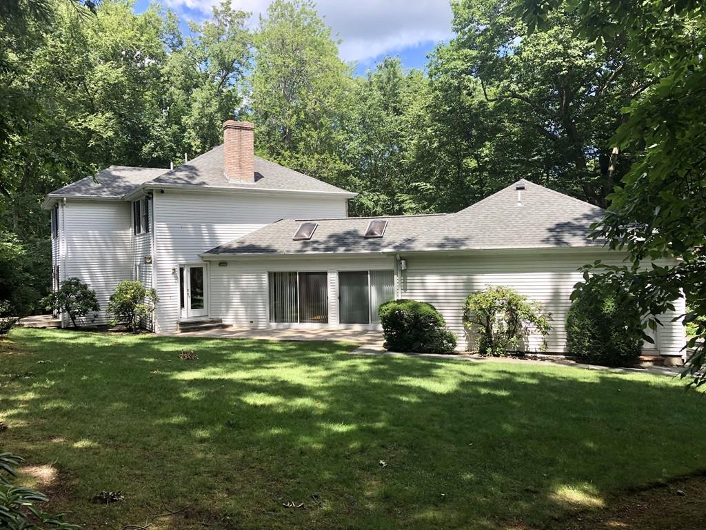 75 Old Farm Road Wellesley, MA 02481 - Photo 5 of 28 a front view of a house with a yard and trees
