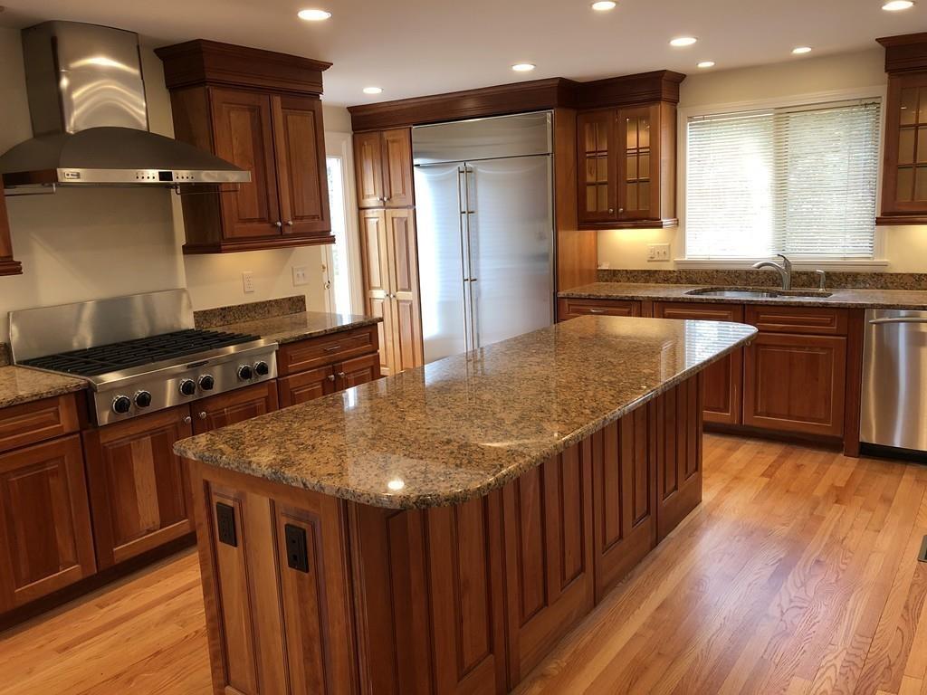 75 Old Farm Road Wellesley, MA 02481 - Photo 8 of 28 a kitchen with stainless steel appliances granite countertop a stove a sink and a refrigerator