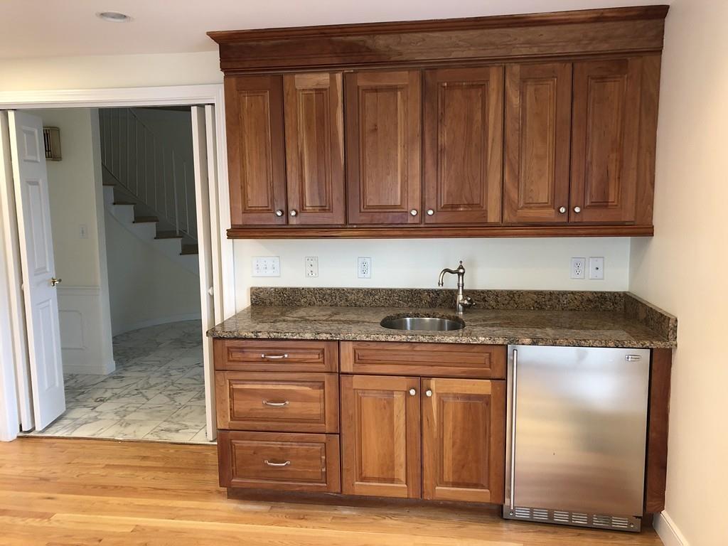 75 Old Farm Road Wellesley, MA 02481 - Photo 10 of 28 a kitchen with stainless steel appliances granite countertop a refrigerator and a stove