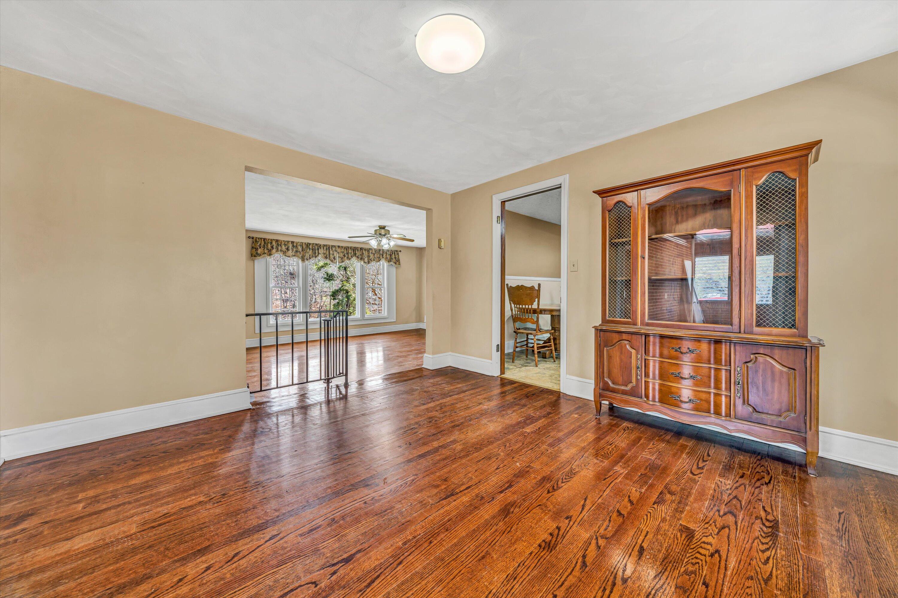 90 Campbellwood Road Boones Mill, VA 24065 - Photo 12 of 38 wooden floor in an empty room with a window