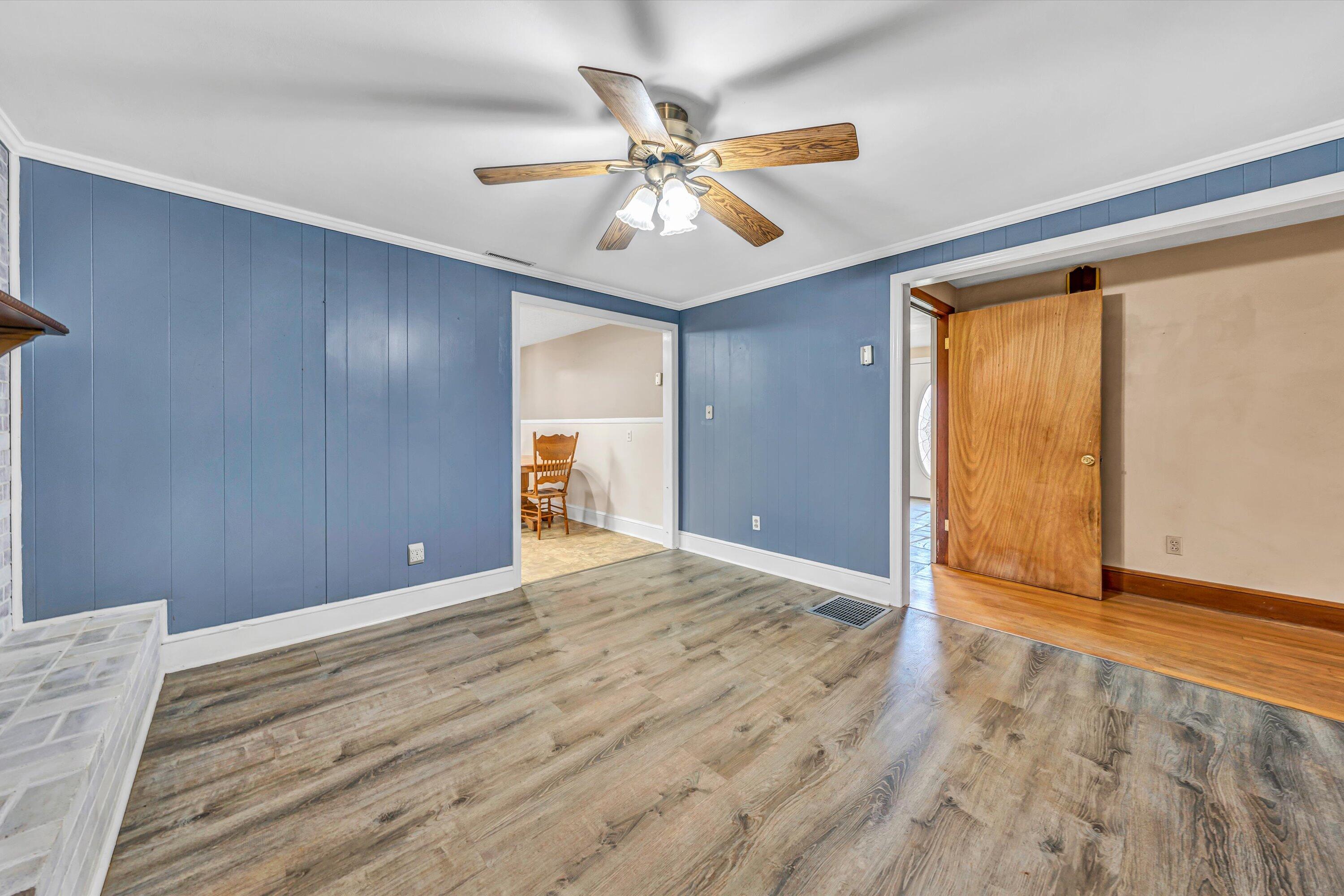 90 Campbellwood Road Boones Mill, VA 24065 - Photo 14 of 38 a view of an empty room with wooden floor and a ceiling fan