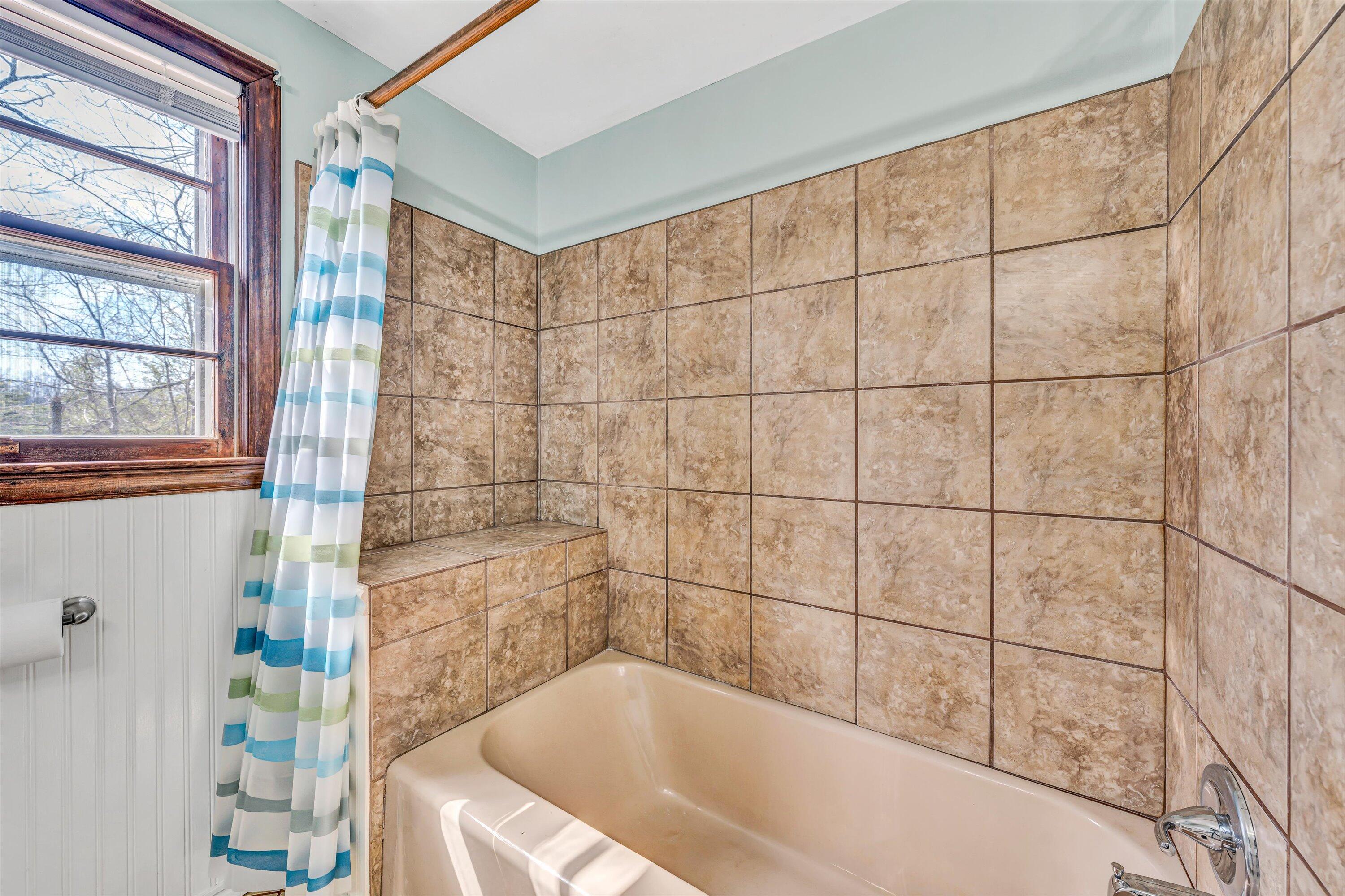 90 Campbellwood Road Boones Mill, VA 24065 - Photo 23 of 38 a bathroom with a bathtub and shower