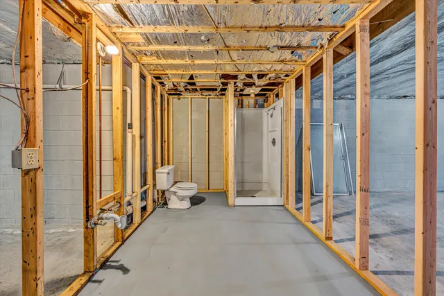 a view of a room with wooden walls