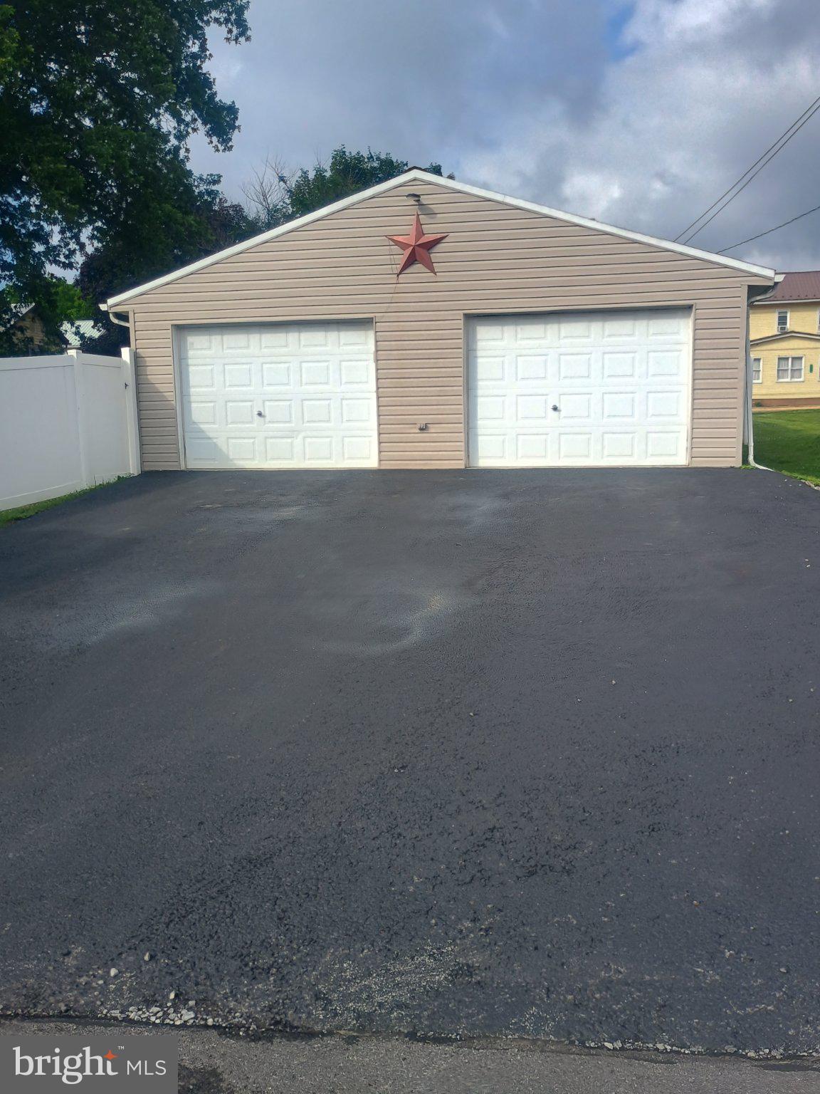 306 Ridgley Street Orbisonia, PA 17243 - Photo 1 of 21 Charming garage with a rustic star.