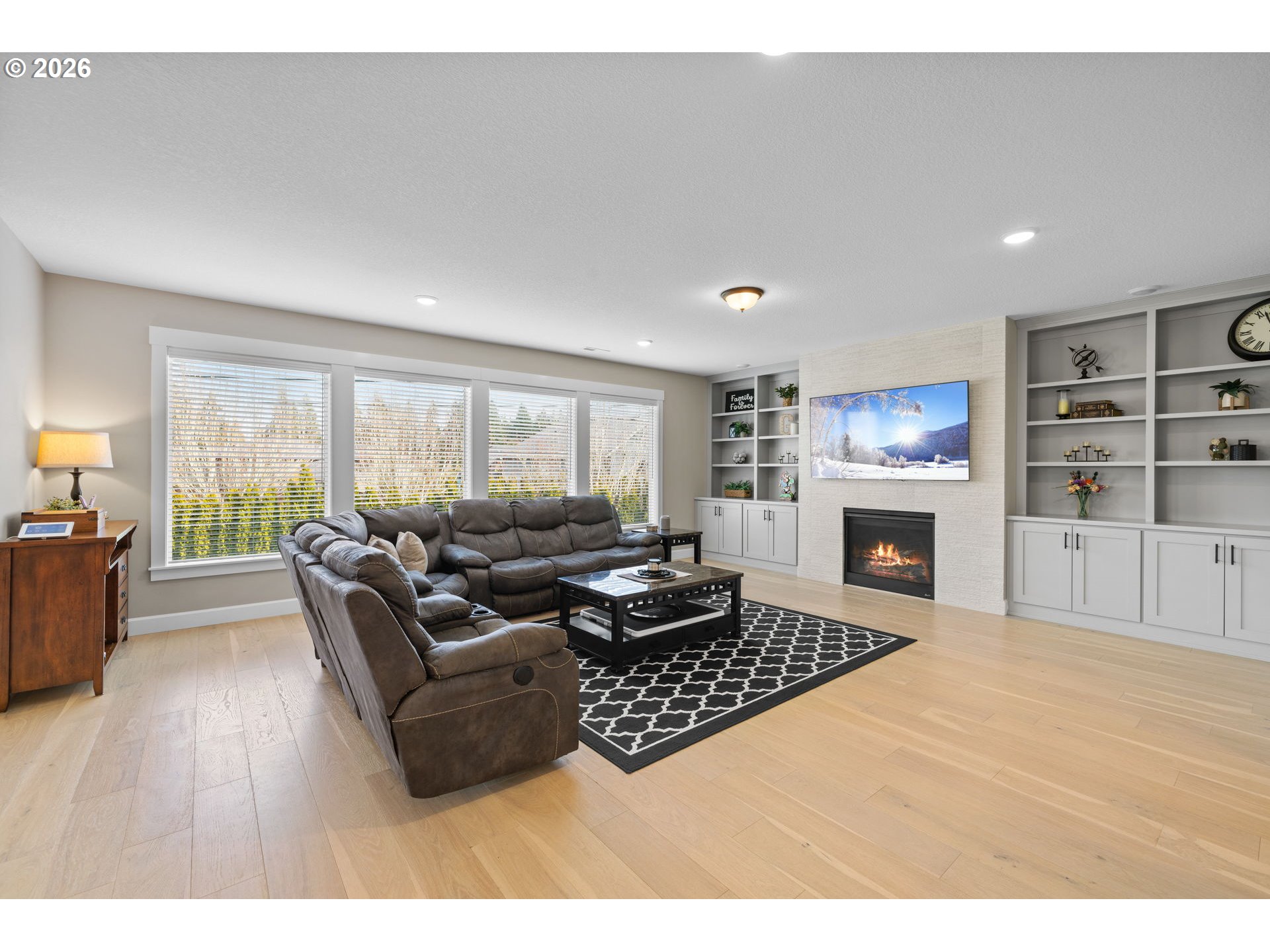17311 Northeast 28th Court Ridgefield, WA 98642 - Photo 12 of 38 a living room with furniture and a fireplace