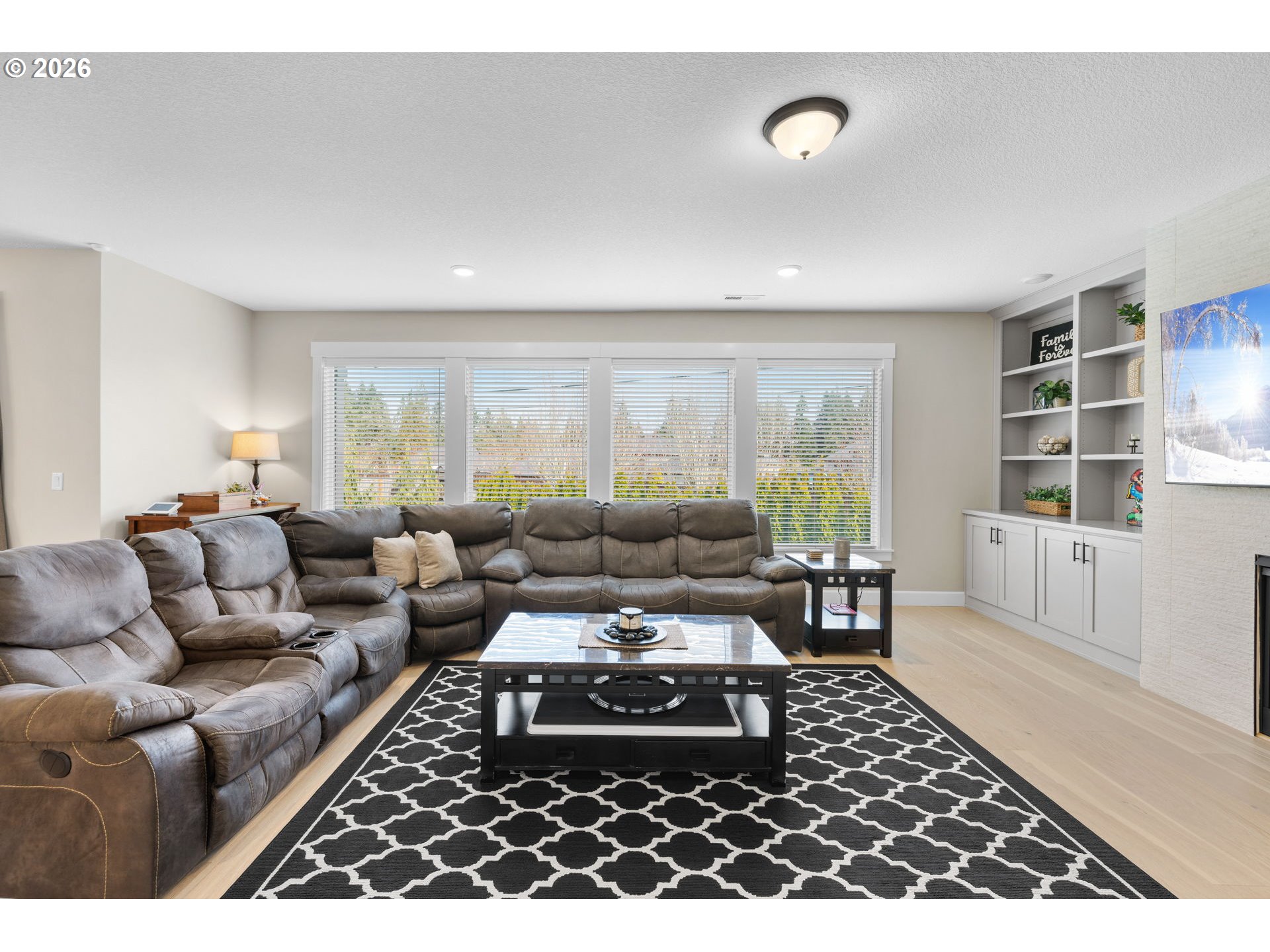 17311 Northeast 28th Court Ridgefield, WA 98642 - Photo 13 of 38 a living room with furniture and a rug