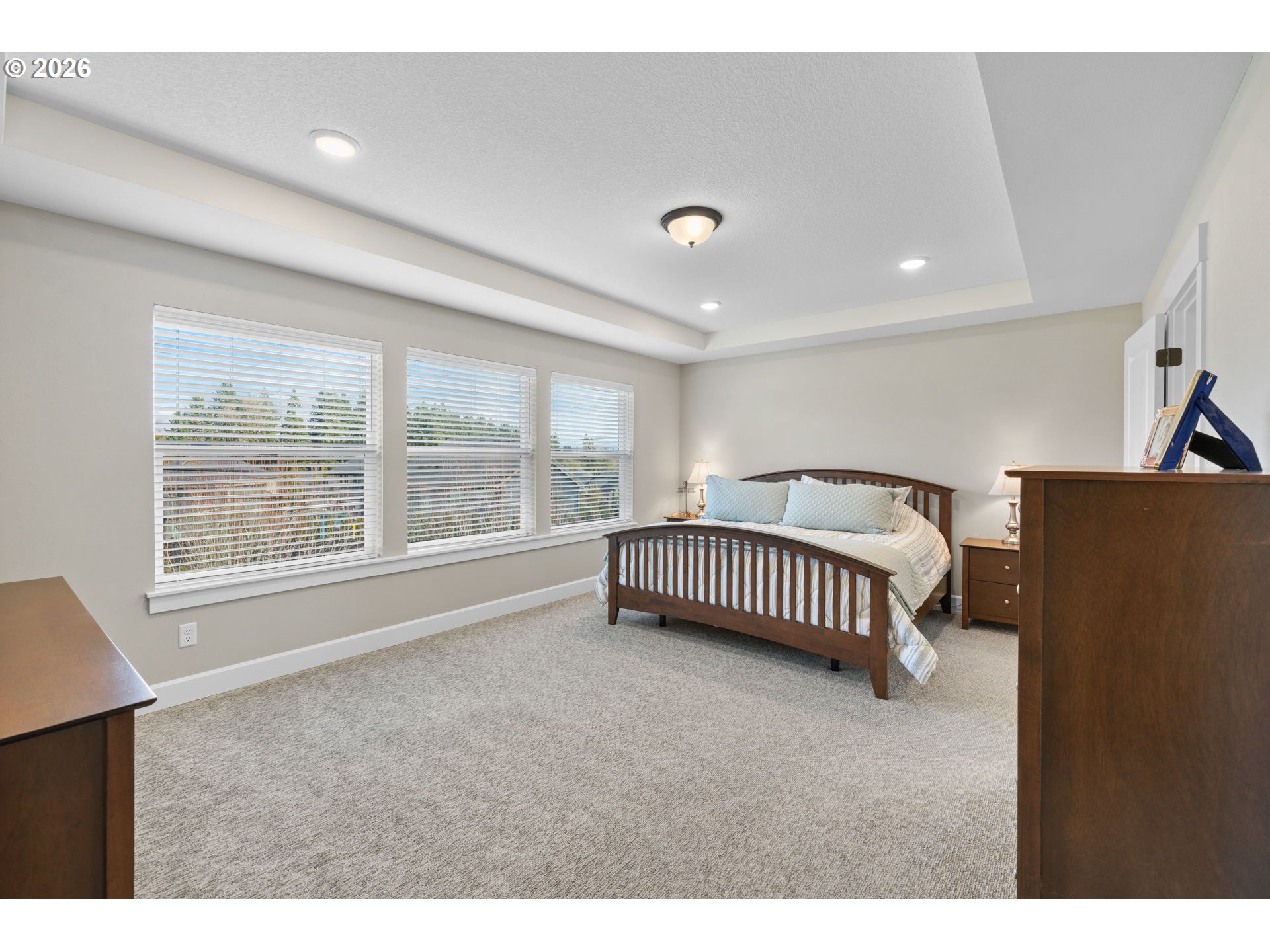 17311 Northeast 28th Court Ridgefield, WA 98642 - Photo 18 of 38 a spacious bedroom with a bed and a large window
