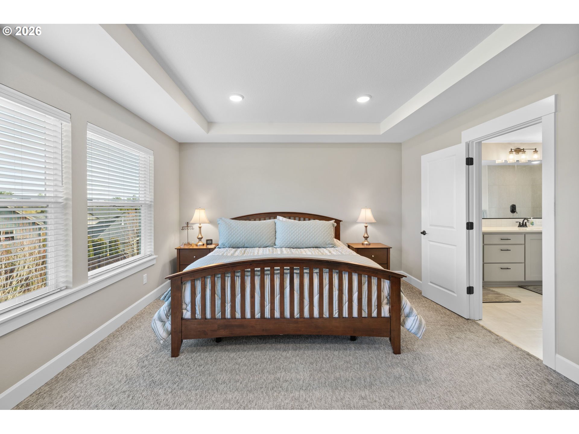 17311 Northeast 28th Court Ridgefield, WA 98642 - Photo 19 of 38 a bedroom with a bed and a large window
