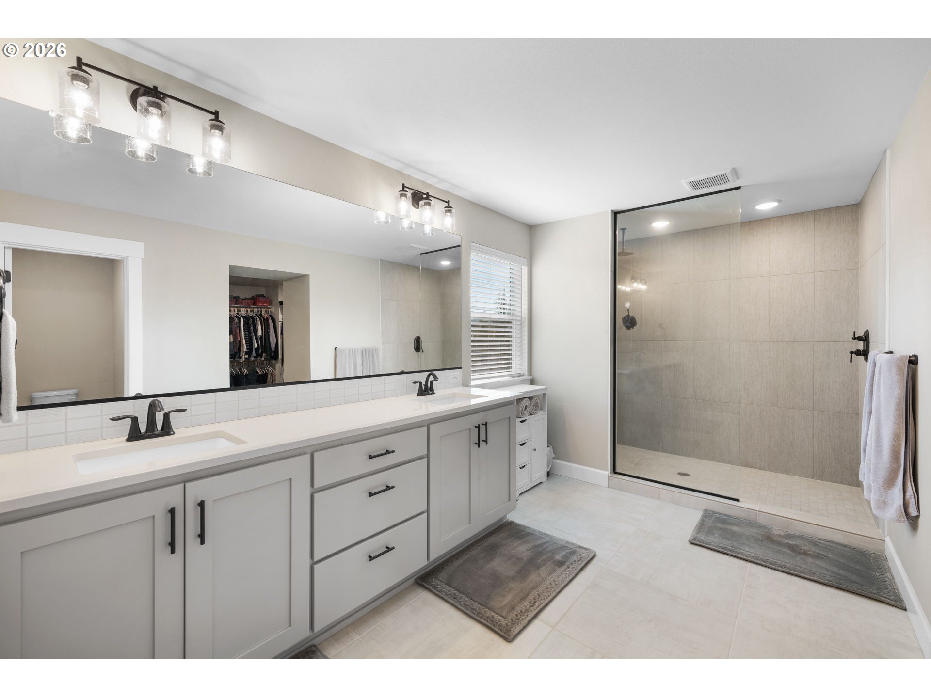 17311 Northeast 28th Court Ridgefield, WA 98642 - Photo 21 of 38 a bathroom with a double vanity sink mirror and double