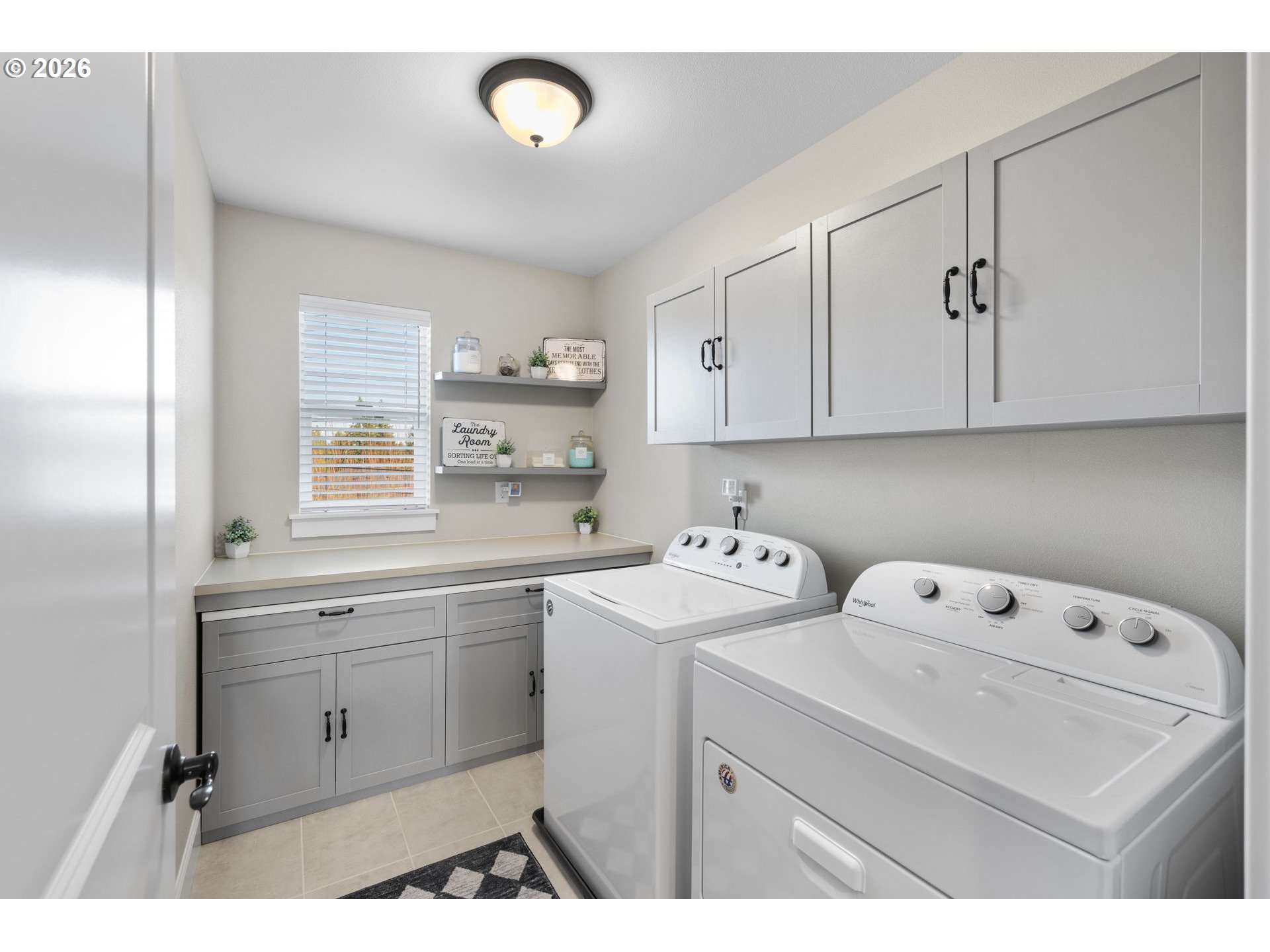 17311 Northeast 28th Court Ridgefield, WA 98642 - Photo 23 of 38 a utility room with cabinets washer and dryer