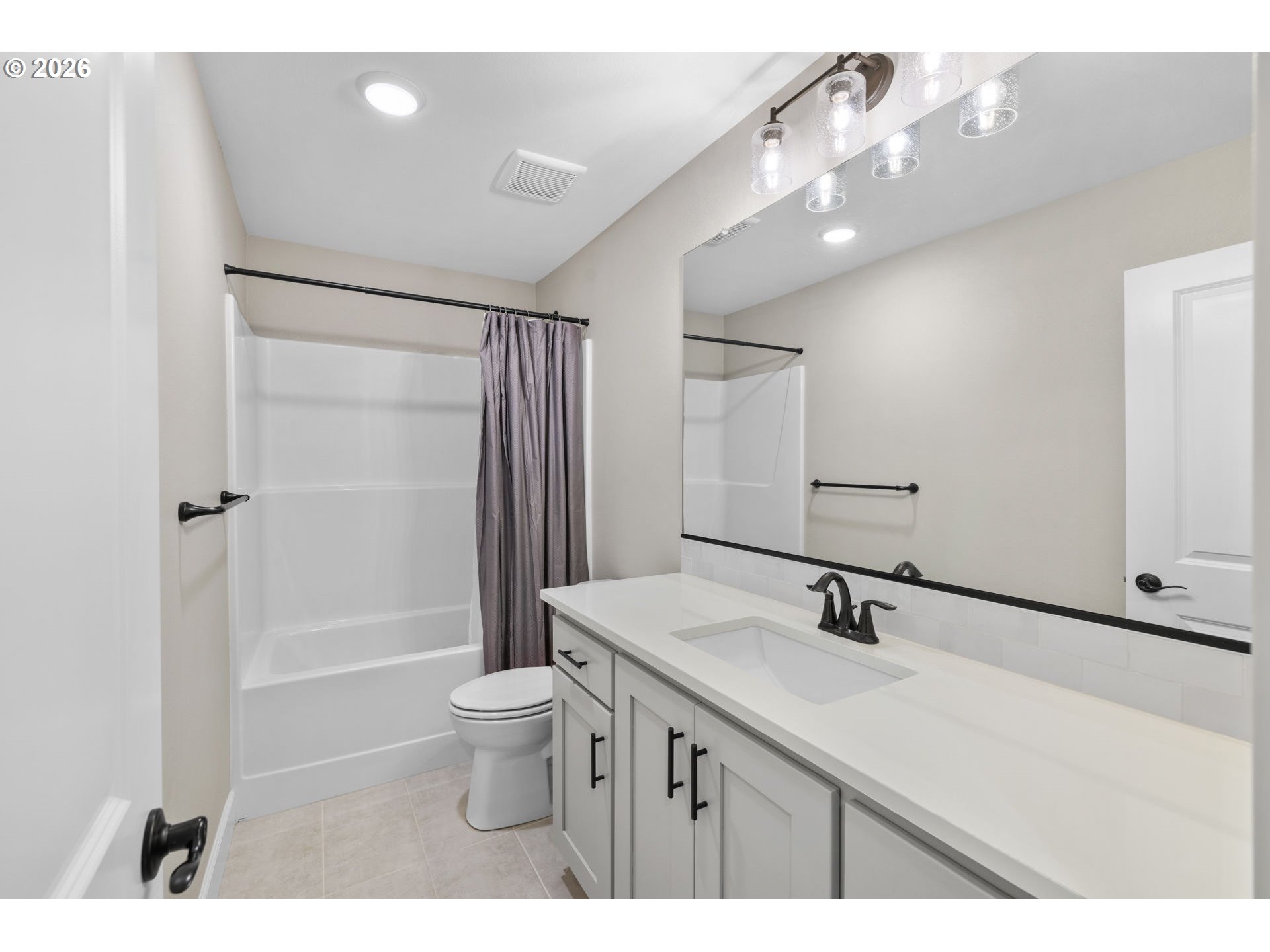 17311 Northeast 28th Court Ridgefield, WA 98642 - Photo 26 of 38 a bathroom with a sink a toilet a mirror and shower