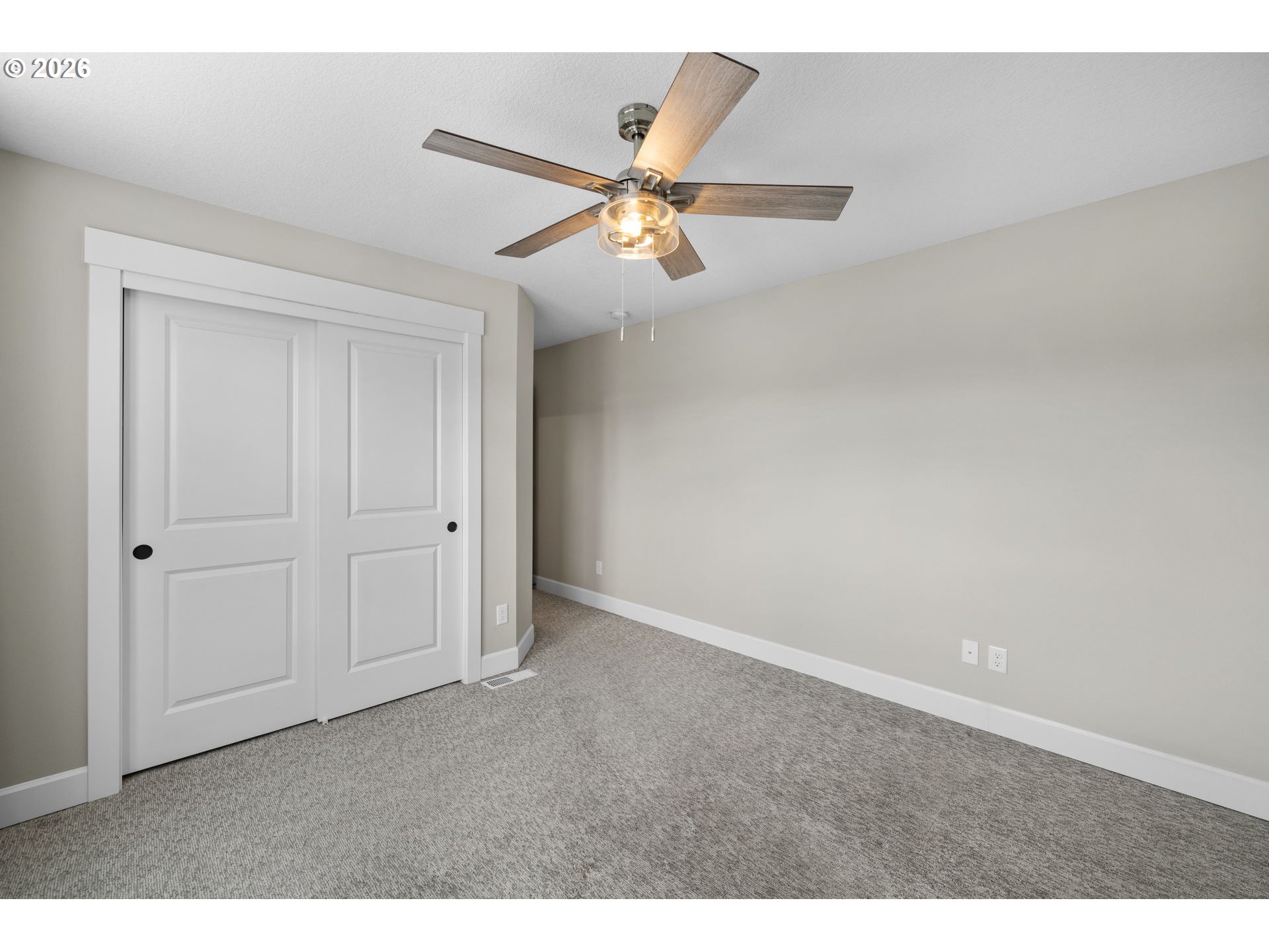 17311 Northeast 28th Court Ridgefield, WA 98642 - Photo 31 of 38 an empty room with closet and a ceiling fan