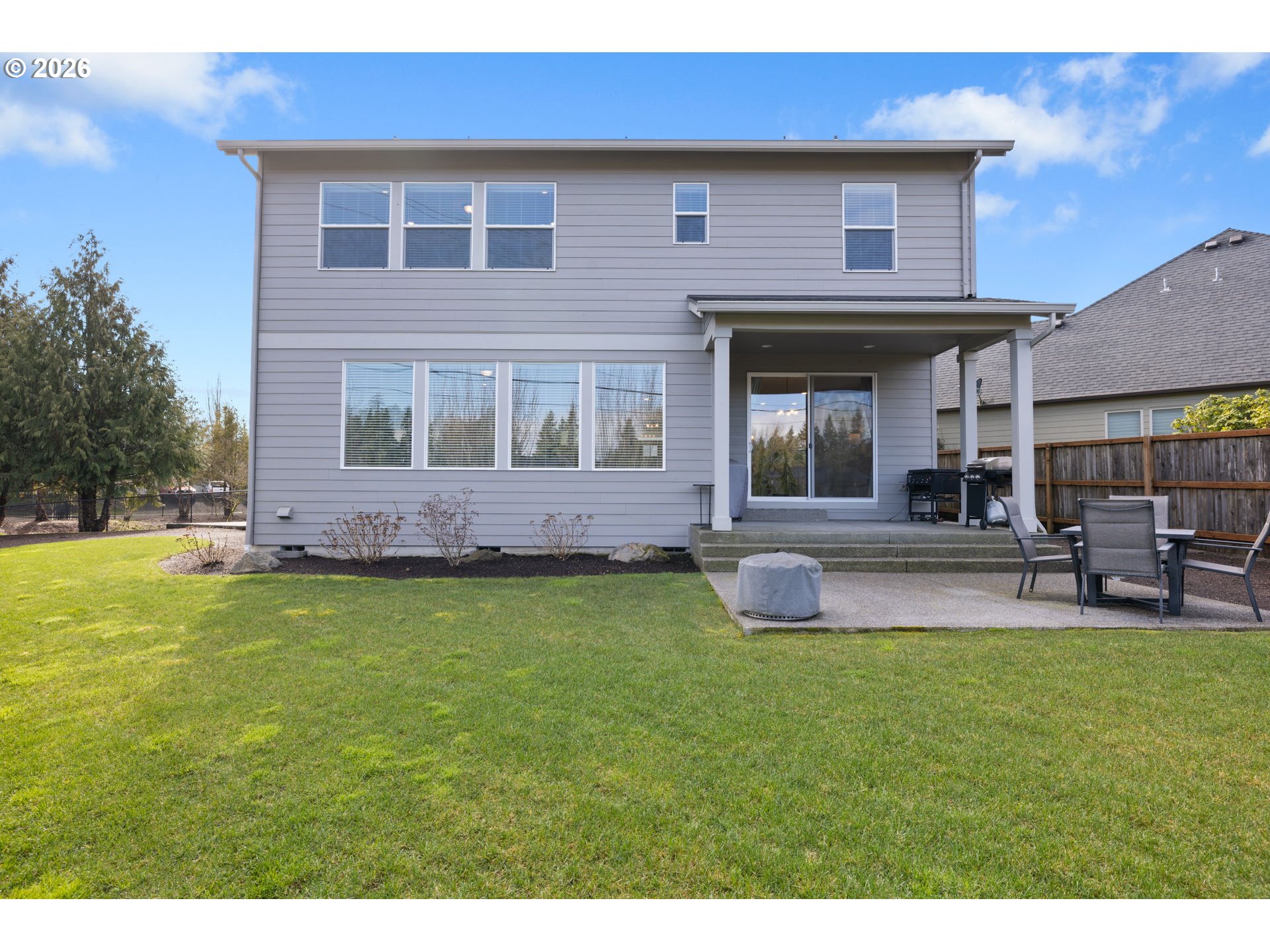 17311 Northeast 28th Court Ridgefield, WA 98642 - Photo 34 of 38 a front view of a house with swimming pool having outdoor seating